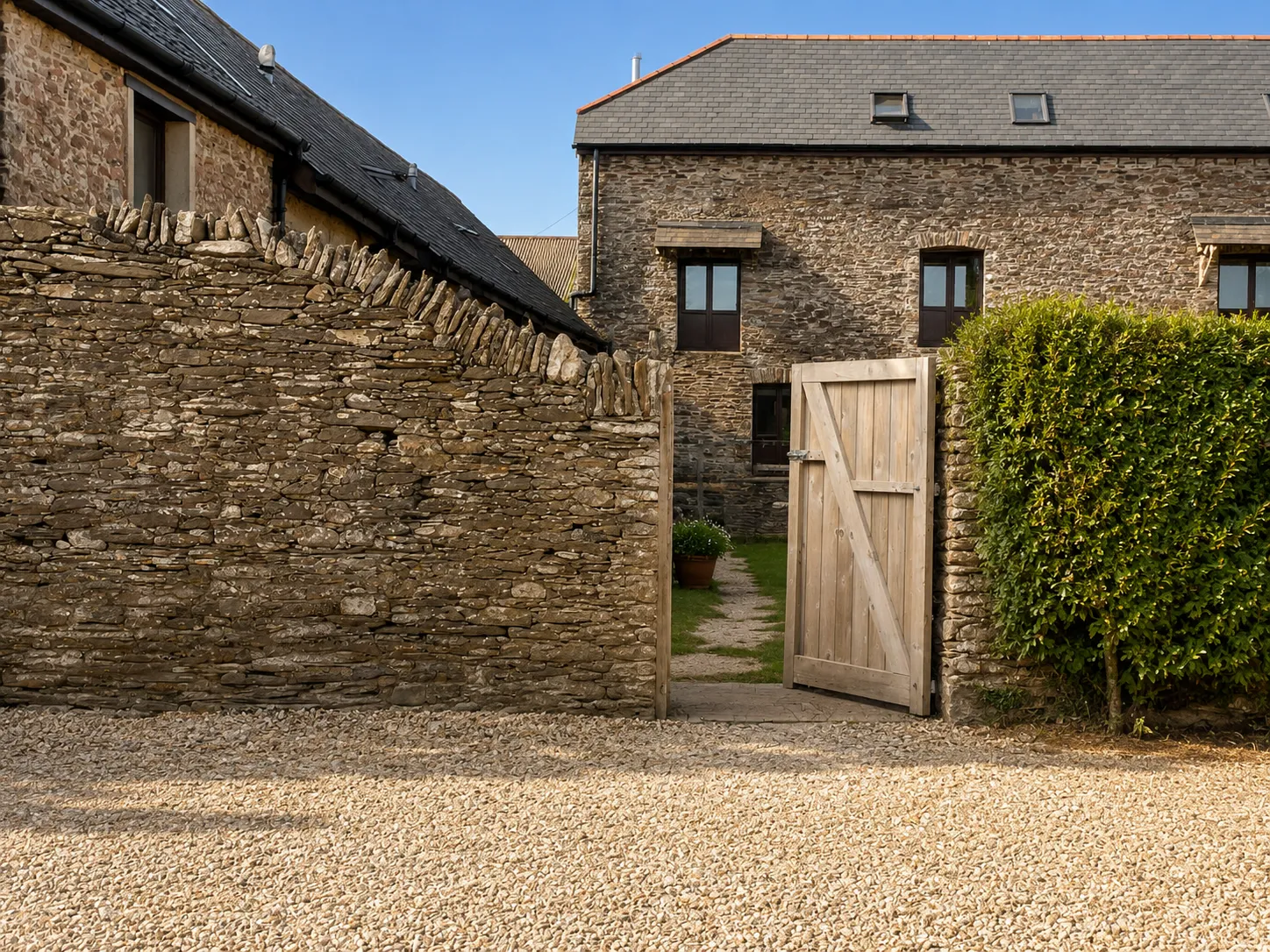 The stone courtyard of Andrew’s farm and holiday cottages in Devon